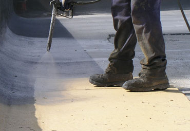 Coating systems over Denver spray foam roof systems